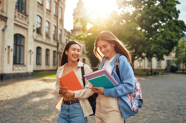 student standing in front of an Australian university campus